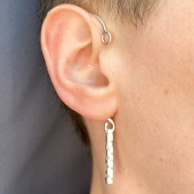 Load image into Gallery viewer, Whole ear cuff worn on ear, shown at three quarters angle
