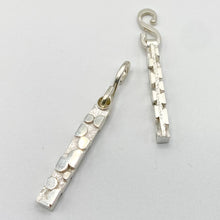Load image into Gallery viewer, Bubble texture earring dangle, one flat and one end-view a flat white surface
