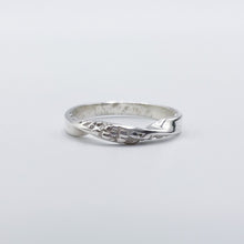 Load image into Gallery viewer, Textured twist ring shown on a flat white surface, front view of the twist.
